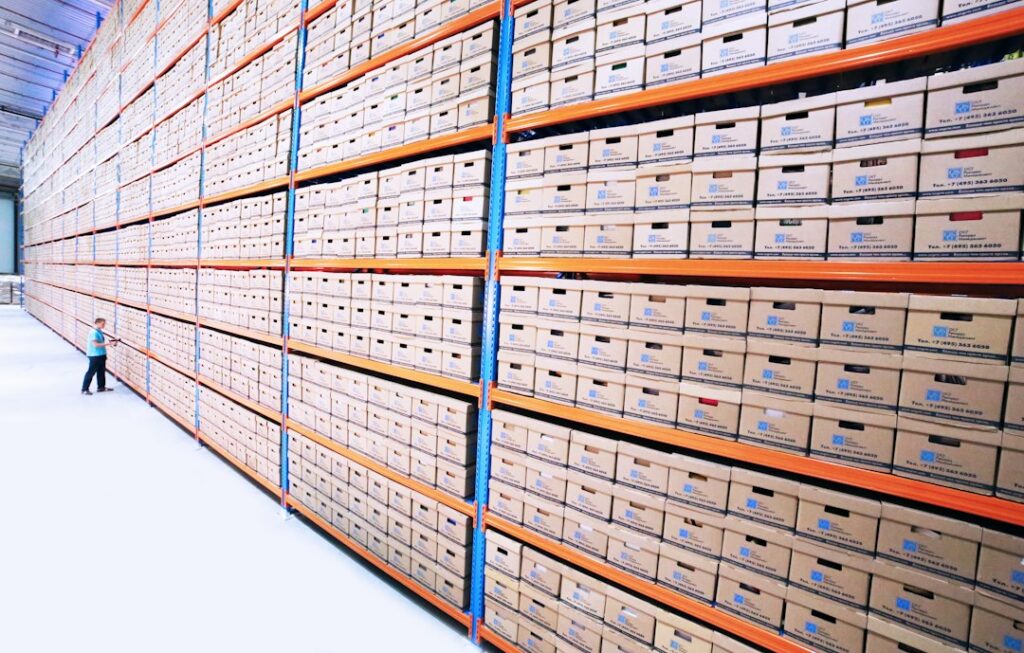 Rows of archive shelves holding stored records, like items available for an archive.org download