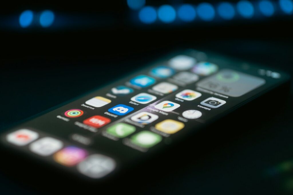 Close-up of a mobile phone on a table, used to look up archived Facebook pages in the Wayback Machine
