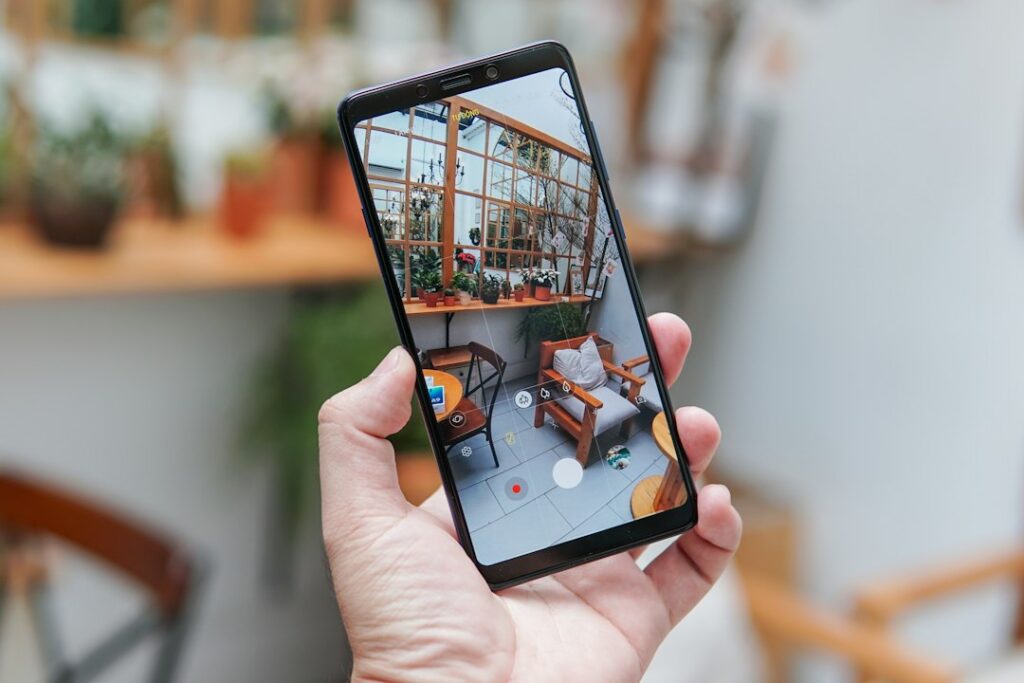 Hand holding a smartphone, used to look up archived Instagram profiles in the Wayback Machine