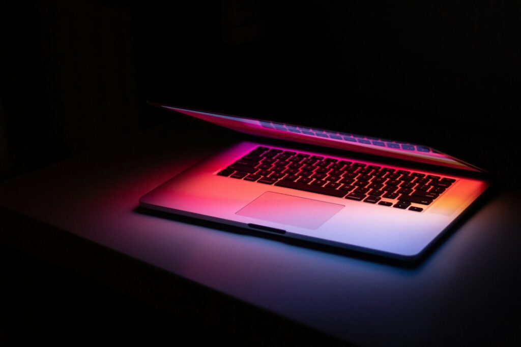 Laptop on a dark desk, used to search archived Reddit threads in the Wayback Machine