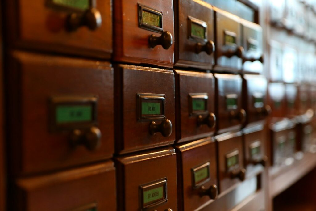 Vintage wooden card catalog drawers, like stored copies you open to view a cached page
