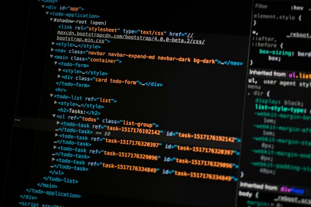 Monitor showing colorful source code, like a script calling the Wayback Machine API