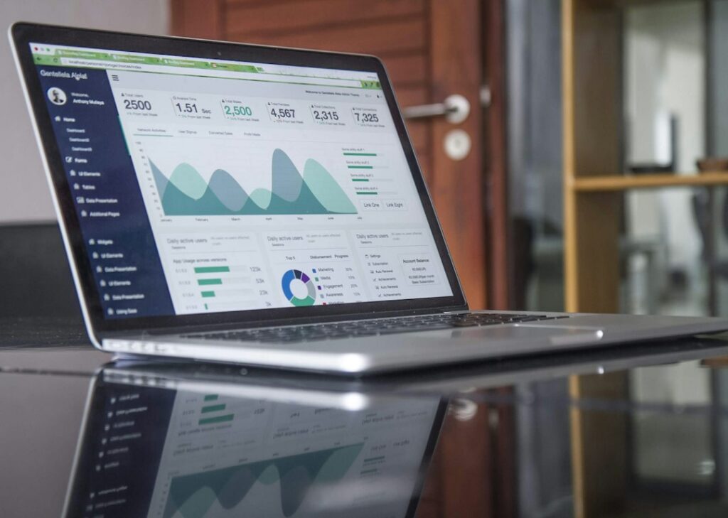 Laptop showing charts and statistics, like data gathered with a Wayback Machine scraper