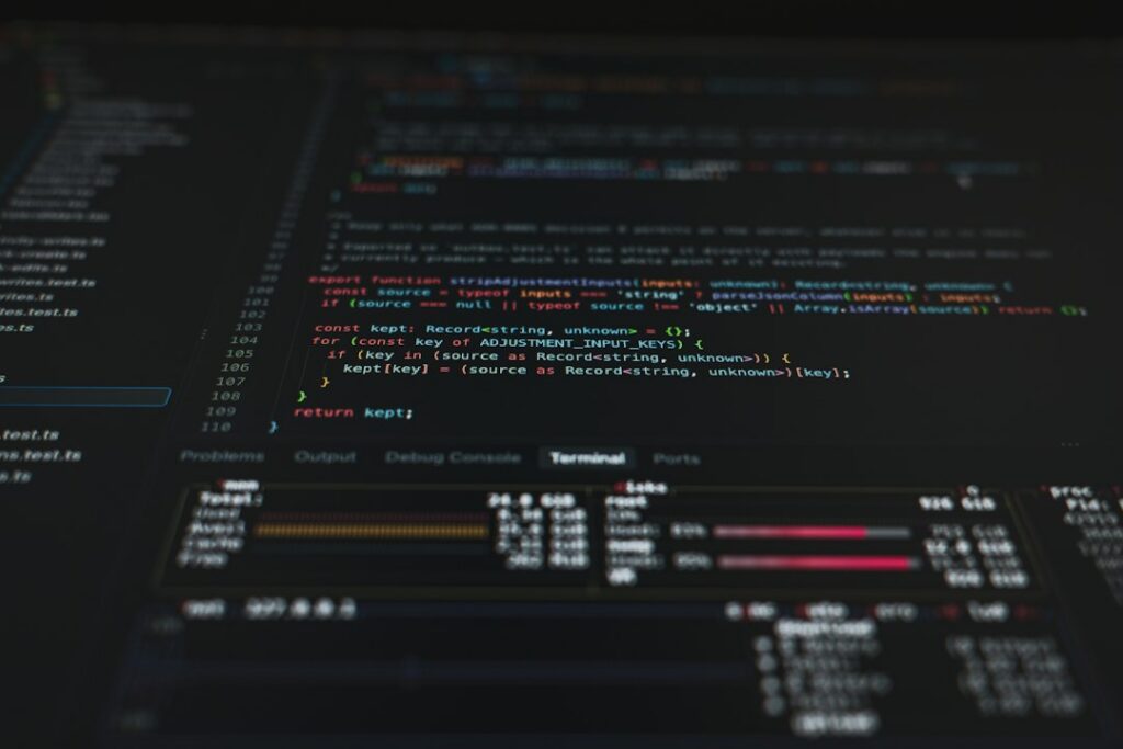 Source code and a terminal on a monitor, as used by a website downloader online to save a site as files